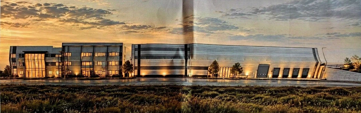 Proposed Waterford packaging facility exterior at dusk
